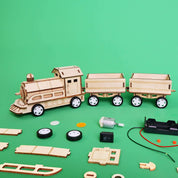 Wooden toy train set with components on a green background