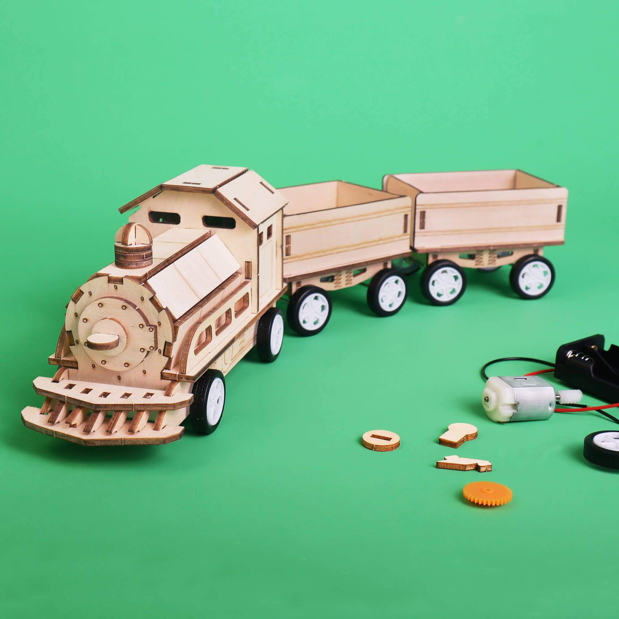 Wooden toy train model on a green background