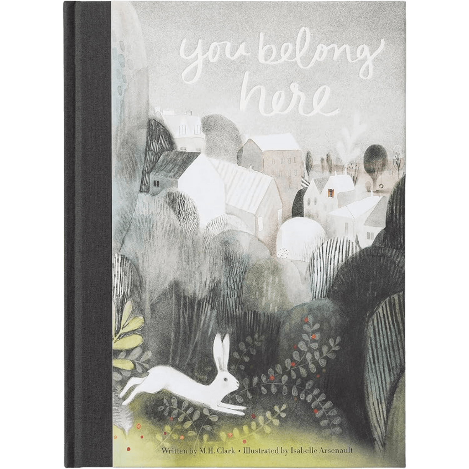 Children's book titled 'you belong here' with a textured, illustrated cover showing a white rabbit in a village landscape. The book has a black spine and is photographed flat against a white background.
